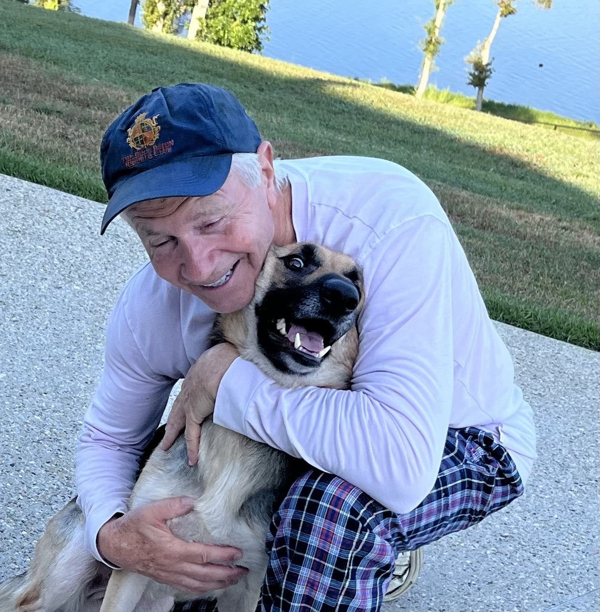 A Rising Sun volunteer sharing a happy moment with a rescue dog